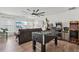Spacious game room with hardwood floors, an entertainment center and arcade games at 1017 Preserve Park Dr, Loganville, GA 30052