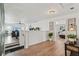 Hallway with hardwood flooring, leading to the living room and bedrooms, with lovely decor at 1017 Preserve Park Dr, Loganville, GA 30052