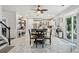 Open kitchen and dining area with marble tile floor, stainless steel appliances, and sliding door to patio at 1017 Preserve Park Dr, Loganville, GA 30052
