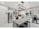 Modern kitchen with stainless steel appliances, granite countertops, and a center island at 1017 Preserve Park Dr, Loganville, GA 30052
