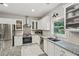 Modern kitchen with stainless steel appliances and light countertops at 1017 Preserve Park Dr, Loganville, GA 30052