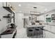 Modern kitchen featuring a large island with seating, stainless steel appliances, and sleek countertops at 1017 Preserve Park Dr, Loganville, GA 30052