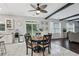 Well-lit kitchen and dining area featuring modern appliances and a seamless transition to the living space at 1017 Preserve Park Dr, Loganville, GA 30052