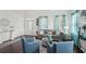 Inviting living room featuring hardwood floors, high ceilings, and elegant decor with plenty of seating at 1017 Preserve Park Dr, Loganville, GA 30052