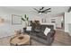Bright living room with a cozy sofa, stylish decor, and ample space for comfortable living at 1017 Preserve Park Dr, Loganville, GA 30052
