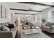 Open-concept living room featuring exposed beams and hardwood floors, steps to the kitchen at 1017 Preserve Park Dr, Loganville, GA 30052