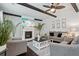 Comfortable living room with exposed beams, a cozy fireplace and dark hardwood floors at 1017 Preserve Park Dr, Loganville, GA 30052