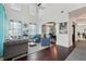 Open-concept living room with hardwood floors, tall ceilings and a view of the dining room at 1017 Preserve Park Dr, Loganville, GA 30052