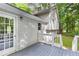 Exterior back deck area featuring an entrance and stairway at 127 Danielle Ct, Villa Rica, GA 30180