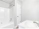 Bathroom featuring tub with shower, white vanity, and modern fixtures at 127 Danielle Ct, Villa Rica, GA 30180