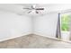 Bedroom featuring carpet, neutral color palette, ceiling fan, and bright window at 127 Danielle Ct, Villa Rica, GA 30180