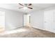 Spacious bedroom featuring carpet, ceiling fan, and neutral color palette at 127 Danielle Ct, Villa Rica, GA 30180