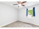 Bedroom featuring carpet, ceiling fan, and bright natural light from the window at 127 Danielle Ct, Villa Rica, GA 30180