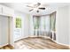Bright dining area featuring wood floors, natural light, and access to the outdoor deck at 127 Danielle Ct, Villa Rica, GA 30180