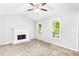Spacious main bedroom with vaulted ceiling, fireplace, carpeting, and natural light from large windows at 127 Danielle Ct, Villa Rica, GA 30180