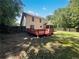 Exterior shot of the backyard with a wooden deck and a view of the yard at 1503 Colt Ridge Se Ln, Mableton, GA 30126