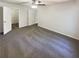 Neutral bedroom with new carpet featuring a ceiling fan and two doors at 1503 Colt Ridge Se Ln, Mableton, GA 30126
