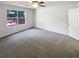 Bright bedroom with carpeted floors, a ceiling fan, and a window view at 1503 Colt Ridge Se Ln, Mableton, GA 30126