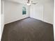 Clean bedroom with neutral carpet, a ceiling fan, and a window view at 1503 Colt Ridge Se Ln, Mableton, GA 30126