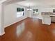 Bright dining area featuring hardwood floors, modern chandelier, and sliding glass doors at 1503 Colt Ridge Se Ln, Mableton, GA 30126