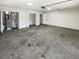 Spacious two car garage with painted walls, concrete floors, and multiple storage options at 1503 Colt Ridge Se Ln, Mableton, GA 30126