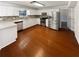 Updated kitchen with white cabinets, stainless steel appliances, and a stylish backsplash at 1503 Colt Ridge Se Ln, Mableton, GA 30126