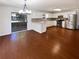 Spacious kitchen featuring stainless steel appliances, white cabinets, and hardwood floors at 1503 Colt Ridge Se Ln, Mableton, GA 30126