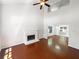 Spacious living room with a fireplace, hardwood floors, vaulted ceilings, and natural light at 1503 Colt Ridge Se Ln, Mableton, GA 30126