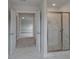 Bathroom view to include a clear glass shower and soaking tub at 157 Haverling Pass, Hampton, GA 30228