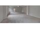 Large bedroom with an en-suite bathroom, plush carpets, and large windows at 157 Haverling Pass, Hampton, GA 30228