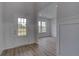 Entryway with white trim, recessed lighting, and view into another room; wood floor at 157 Haverling Pass, Hampton, GA 30228