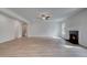 Bright living room with a fireplace and wood flooring at 157 Haverling Pass, Hampton, GA 30228
