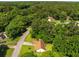 Aerial view of the home and surrounding tree-lined neighborhood at 2617 Laurel Woods Se Ln, Conyers, GA 30094