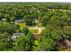 Aerial view of the home nestled in a lush, green, tree-filled neighborhood at 2617 Laurel Woods Se Ln, Conyers, GA 30094