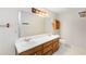 Bright bathroom boasting double sinks and wooden cabinets at 2617 Laurel Woods Se Ln, Conyers, GA 30094