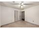 Simple bedroom with carpeted floor, featuring neutral walls and two access doors at 2617 Laurel Woods Se Ln, Conyers, GA 30094