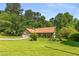 Charming one-story home featuring an attached two-car garage, mature trees, and a well-maintained lawn at 2617 Laurel Woods Se Ln, Conyers, GA 30094