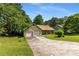 Charming one-story home featuring an attached two-car garage, mature trees, and a well-maintained lawn at 2617 Laurel Woods Se Ln, Conyers, GA 30094