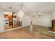 Open-concept layout with wood-look floors seamlessly connects the living room and kitchen at 2617 Laurel Woods Se Ln, Conyers, GA 30094