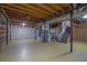 Spacious unfinished basement with exposed beams, stairs and utilities, offering potential for customization at 4516 Creekwood Circle Nw, Kennesaw, GA 30152