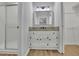 Bathroom featuring an updated walk-in shower, new granite countertops, and updated floors at 4516 Creekwood Circle Nw, Kennesaw, GA 30152