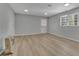 Well-lit room showcasing modern flooring, neutral paint, and plenty of natural light at 4516 Creekwood Circle Nw, Kennesaw, GA 30152