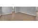 Bedroom featuring hardwood floors, light walls, and an ensuite bathroom at 4516 Creekwood Circle Nw, Kennesaw, GA 30152