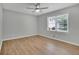 A bedroom filled with light, thanks to the window and the light colored walls and floor at 4516 Creekwood Circle Nw, Kennesaw, GA 30152