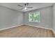 A bedroom filled with light, thanks to the window and the light colored walls and floor at 4516 Creekwood Circle Nw, Kennesaw, GA 30152
