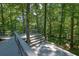 Deck with stairs overlooking beautiful wooded backyard, excellent for entertaining at 4516 Creekwood Circle Nw, Kennesaw, GA 30152
