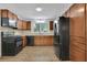Well-equipped kitchen featuring stainless steel appliances and classic wood cabinets at 4516 Creekwood Circle Nw, Kennesaw, GA 30152