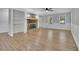 Spacious living room featuring a stone fireplace, built-in shelves, and wood-look flooring at 4516 Creekwood Circle Nw, Kennesaw, GA 30152