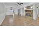 Bright open-concept living space featuring wood floors and a stone fireplace, perfect for entertaining at 4516 Creekwood Circle Nw, Kennesaw, GA 30152