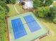 Aerial view featuring community tennis courts and surrounding lush greenery at 75 Hunters Ct, Dallas, GA 30157